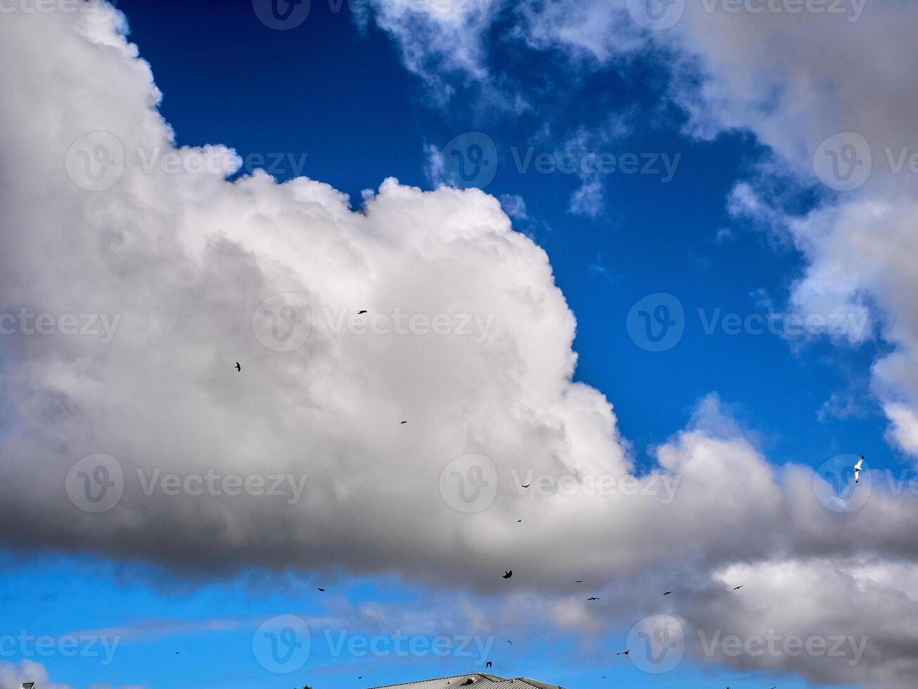 White fluffy clouds in the deep blue sky. Heaven background photo