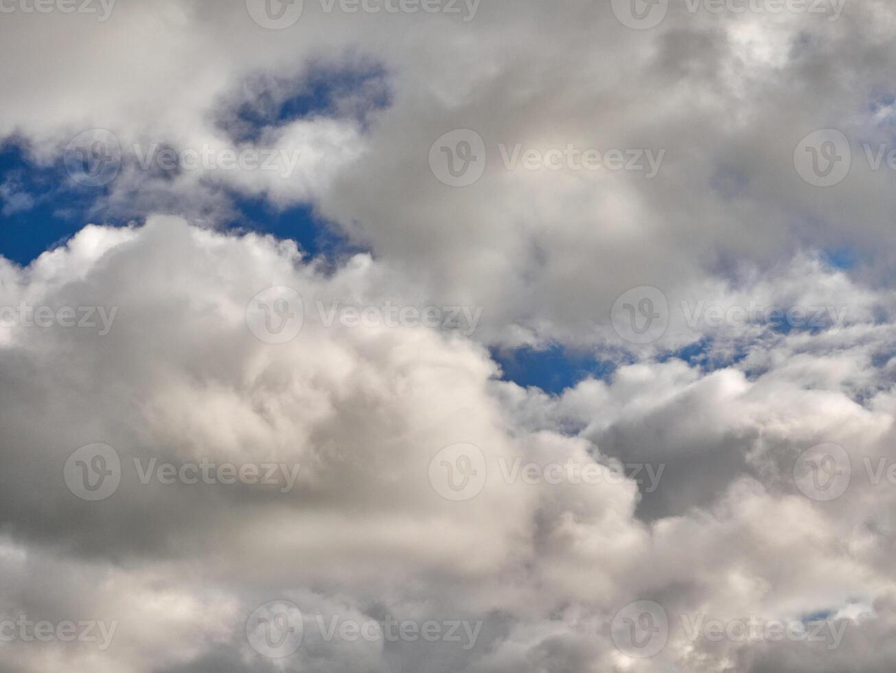 White fluffy clouds in the deep blue sky. Heaven background photo