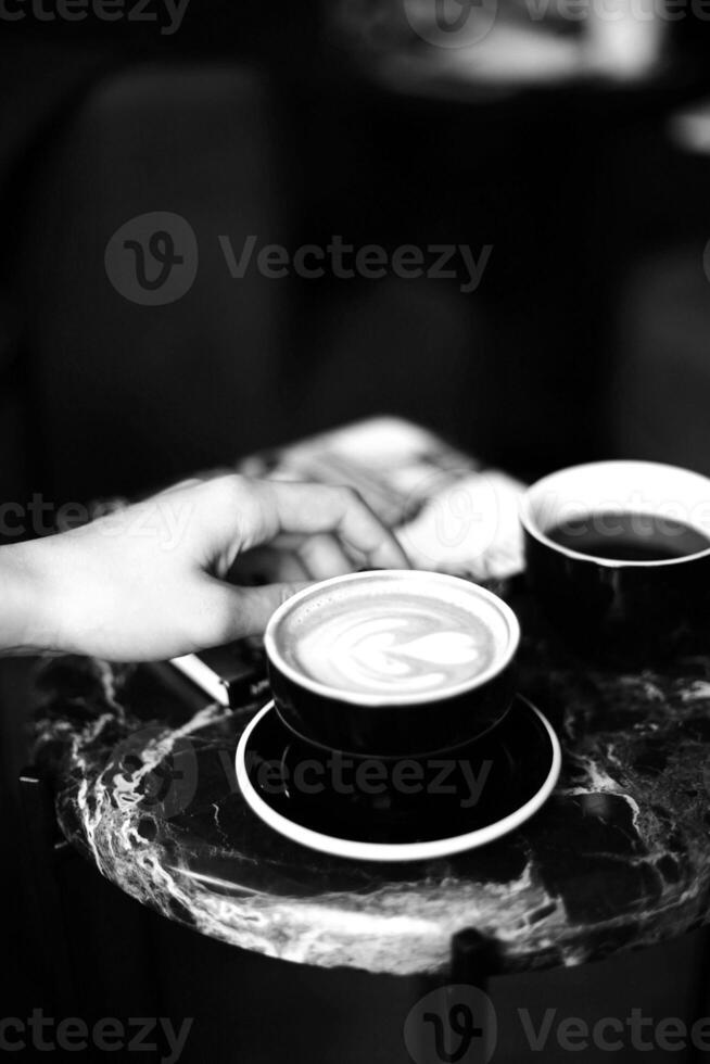 Coffee cup close vew black and white photo background, cup of tea or coffee on the table