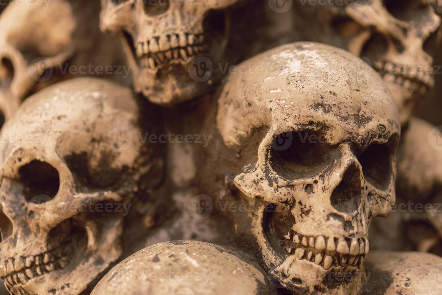 Skull Halloween Background Many People Skulls Stand on top of each other. Mystic creepy concept. Abstract nightmare occult memorial photo