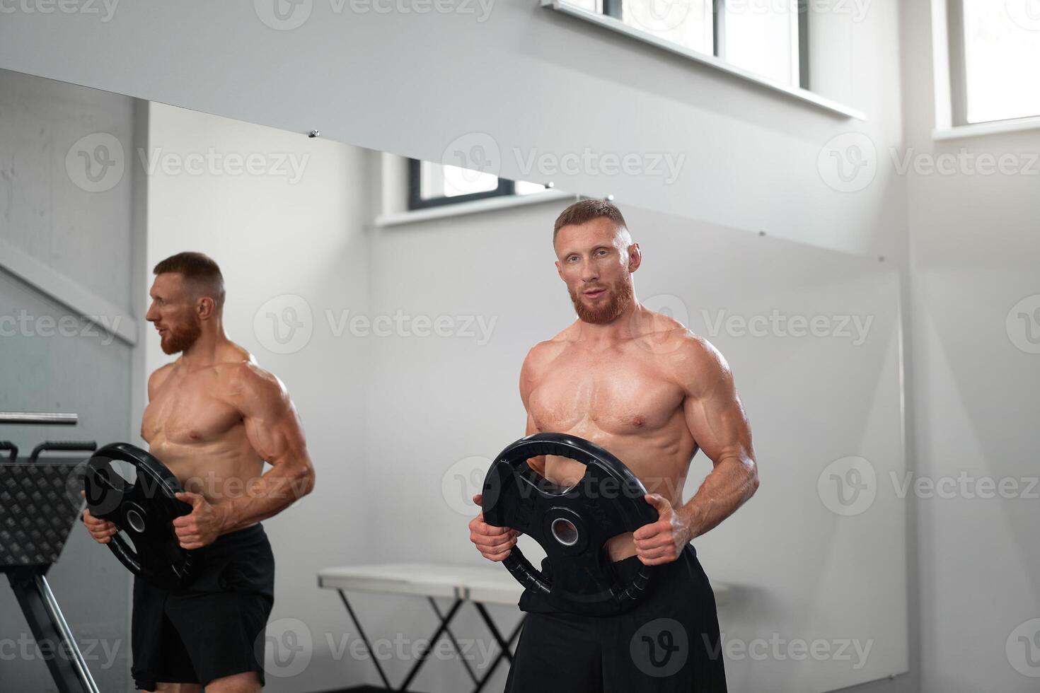 Athlete sportive man gym Middle adult handsome sportsman bodybuilder weightlifter ideal body photo