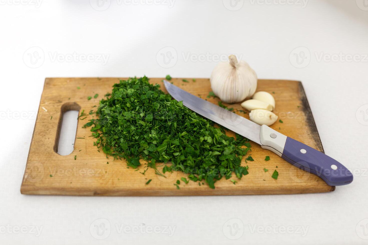 cutting board knife onion garlic photo