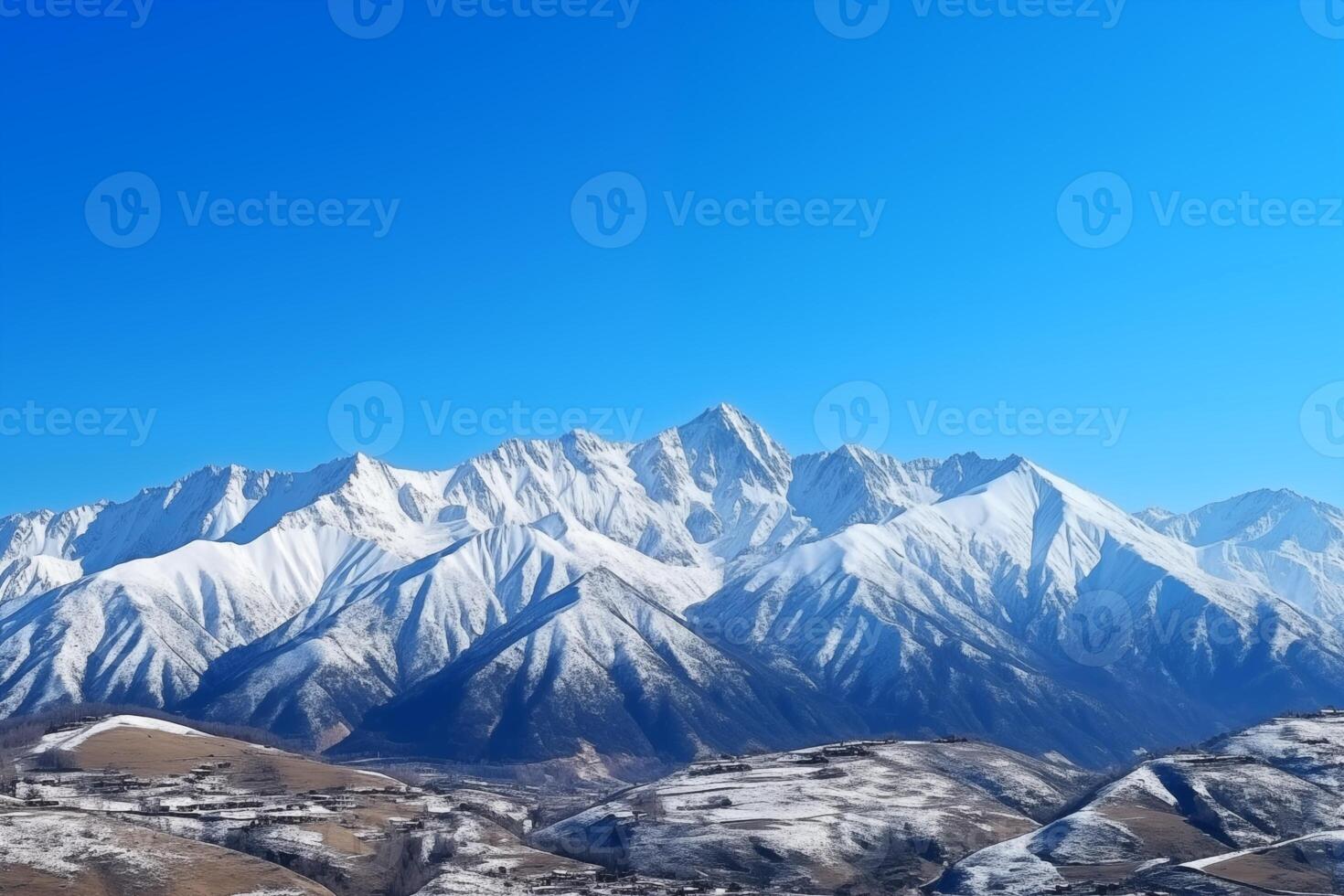 ai generado majestuoso nevadas montaña rango debajo un claro azul cielo en un soleado día foto