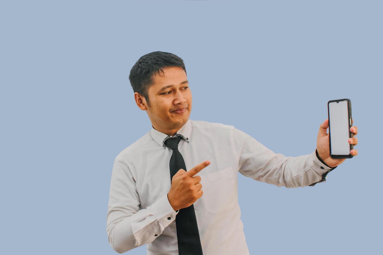 Side View A man showing excited while pointing to blank phone screen that he hold photo