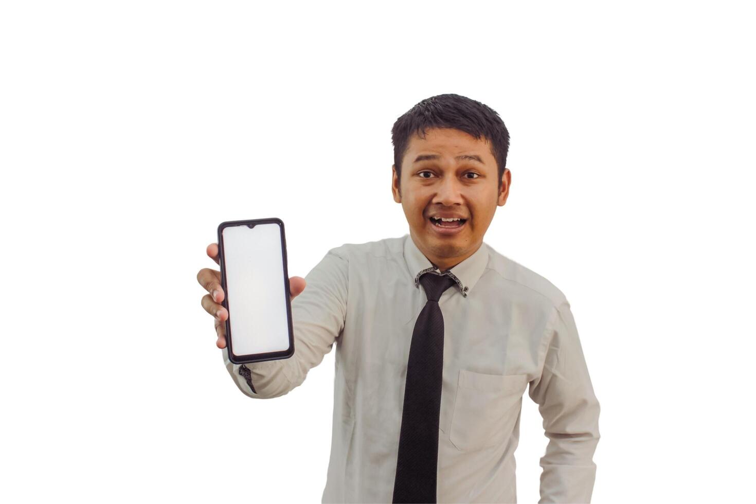Unhappy  Asian man  holding smartphone with blank screen isolated on white background photo
