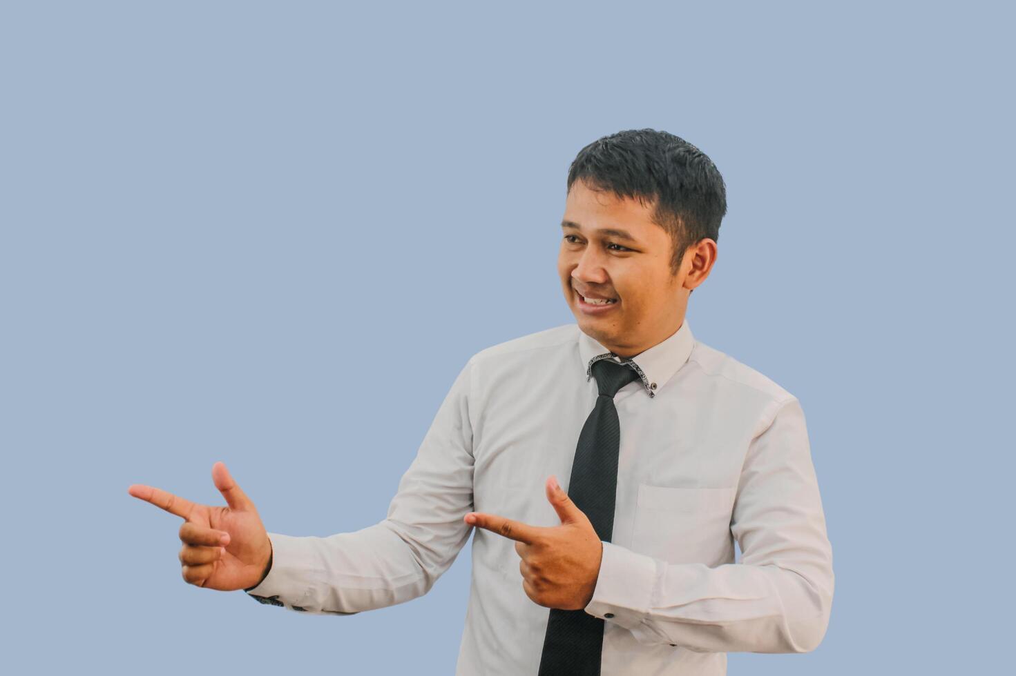 Adult Asian man smiling confident with both hand pointing to the right side photo