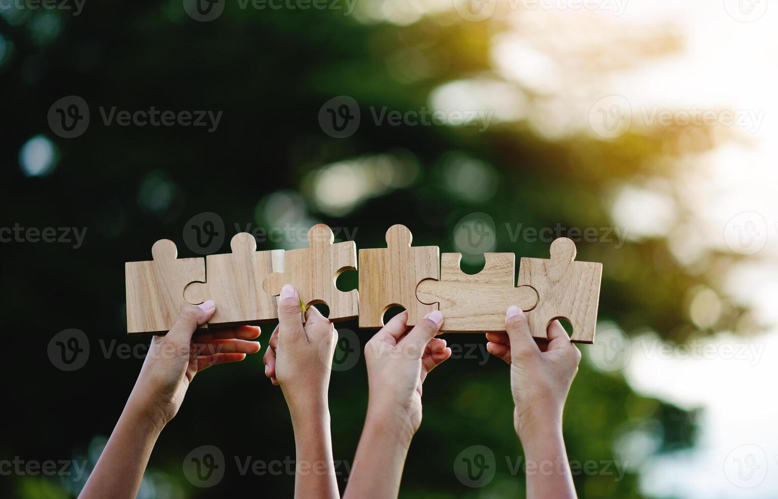 Jigsaw puzzle pieces of cooperation and teamwork Aim for great success in work. photo