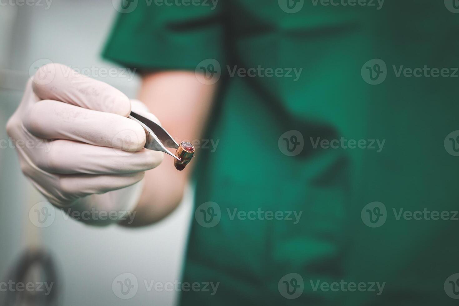 surgeon Remove the bullet from the patient's body in the operating room in the hospital. accident concept emergency surgery photo