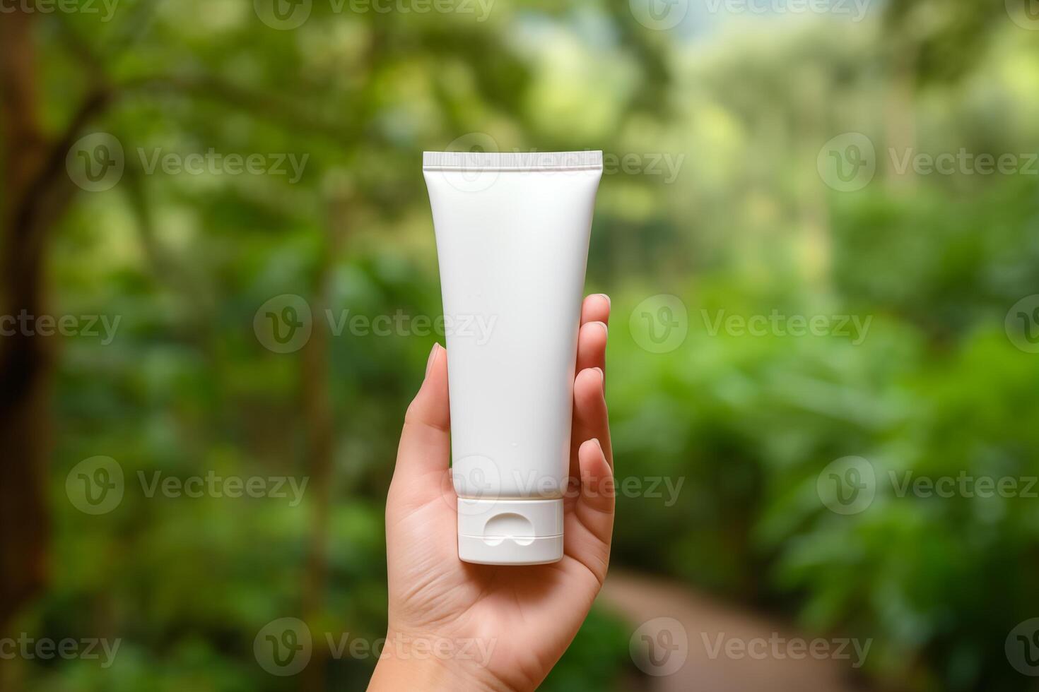 AI generated Hand holding blank white cosmetic tube mockup on nature trees background photo
