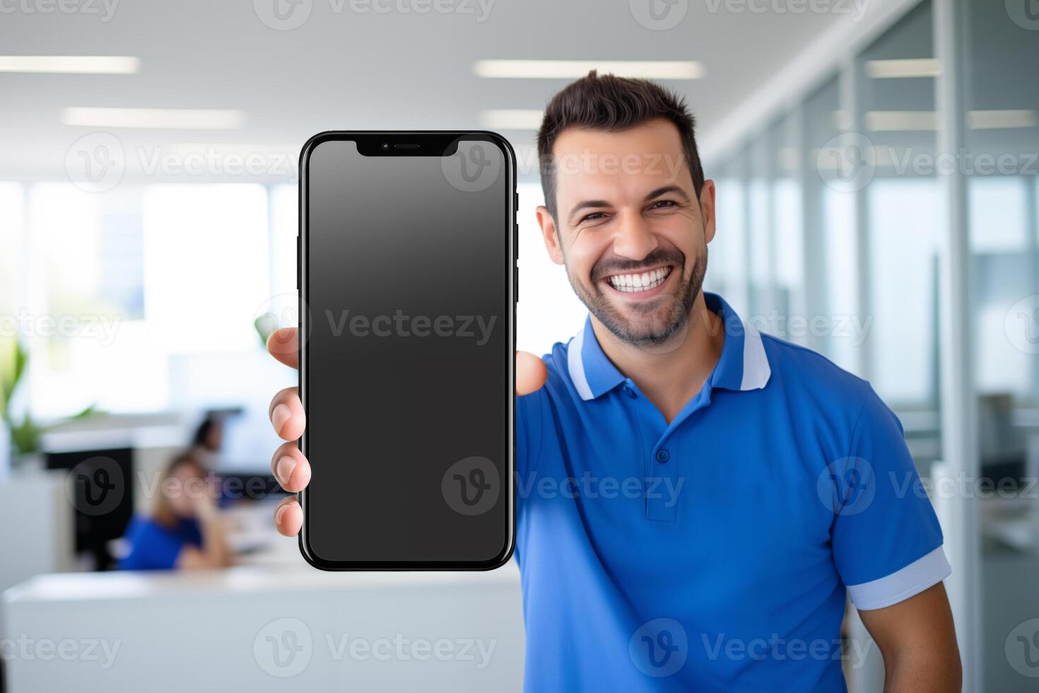 AI generated Man in blue polo shirt showing black blank screen smartphone mockup at office photo