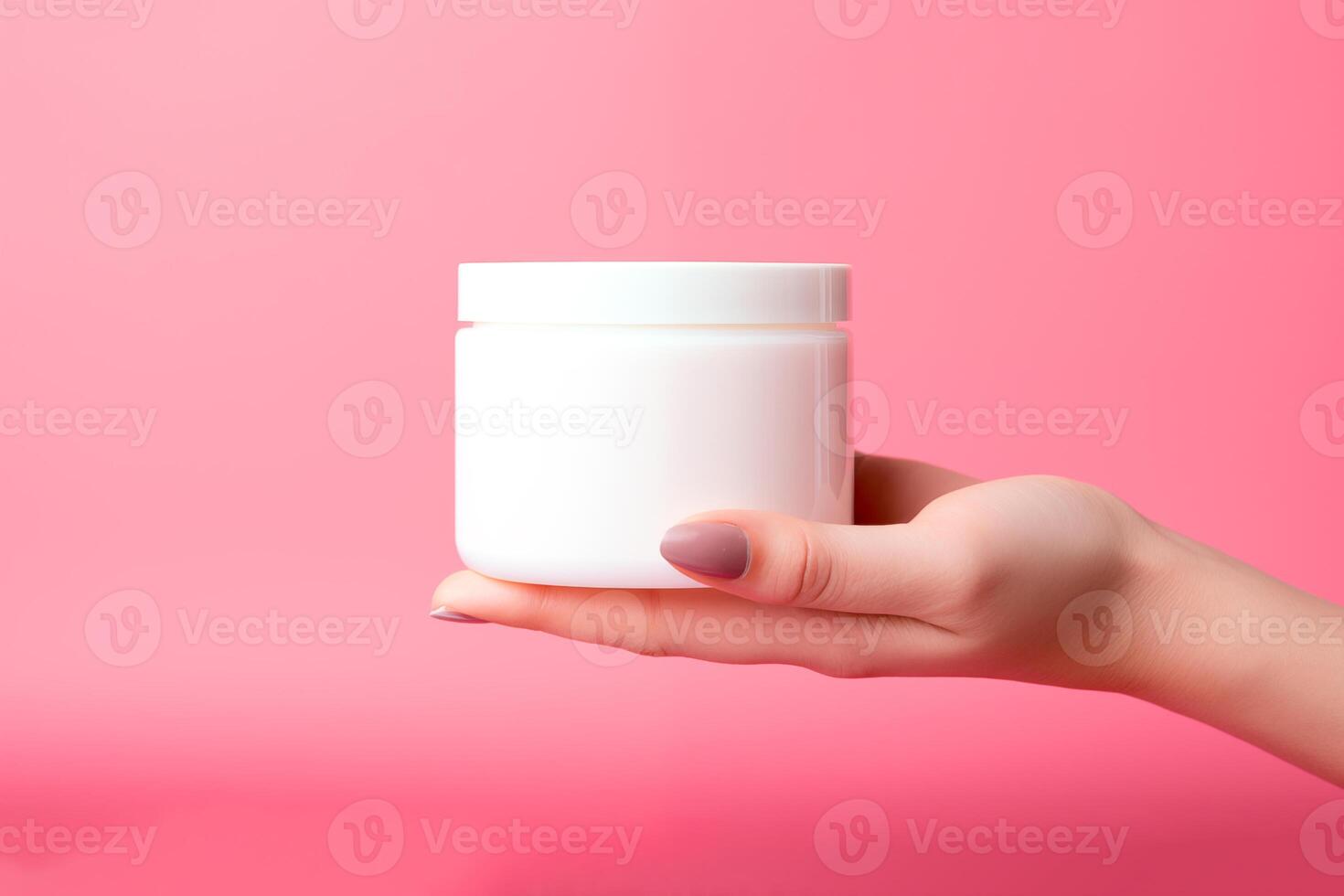 AI generated Woman hand holding blank white cosmetic jar mockup on pink background photo