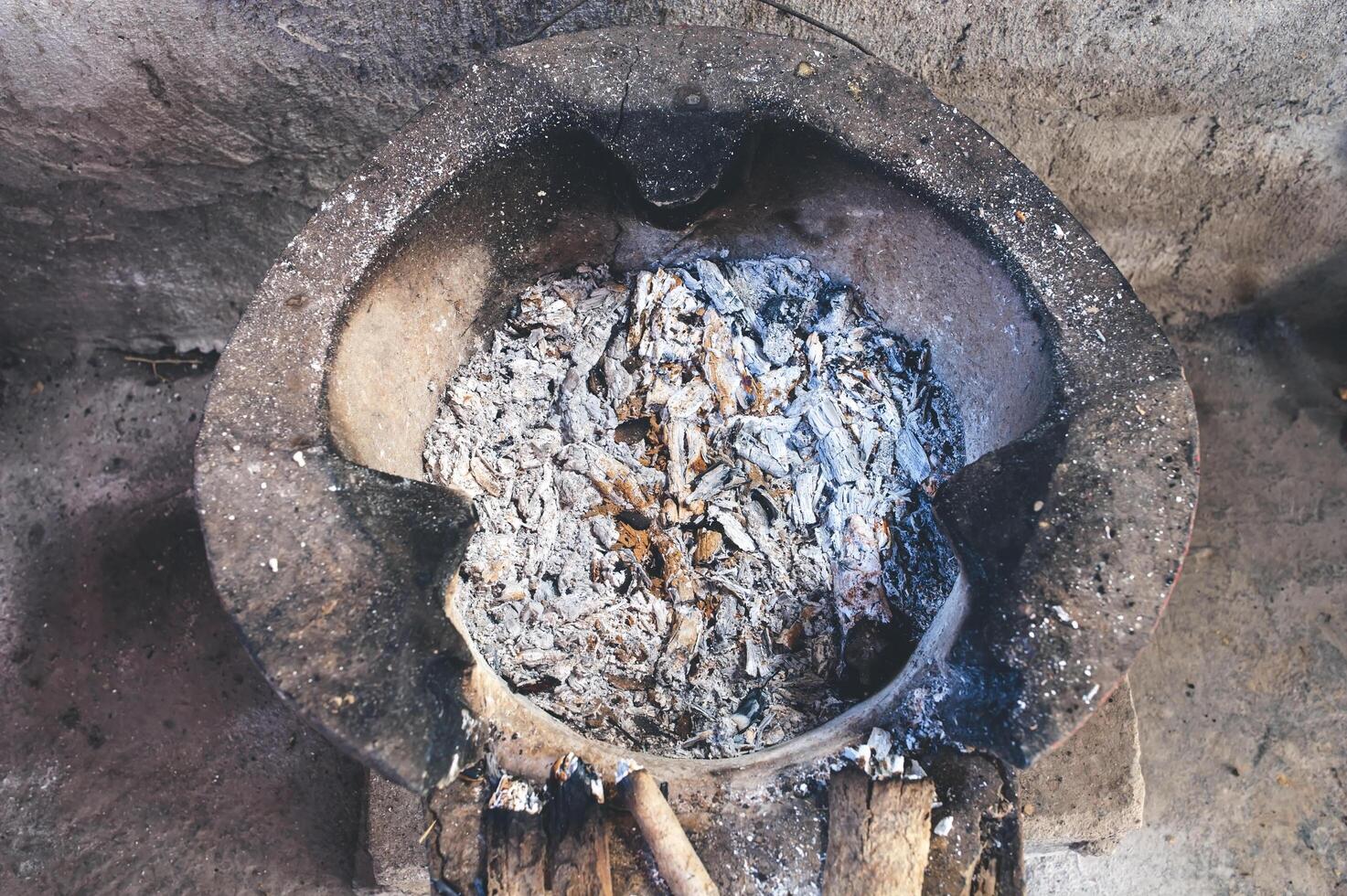 The coals are burned to ashes on a retro-style clay oven. photo