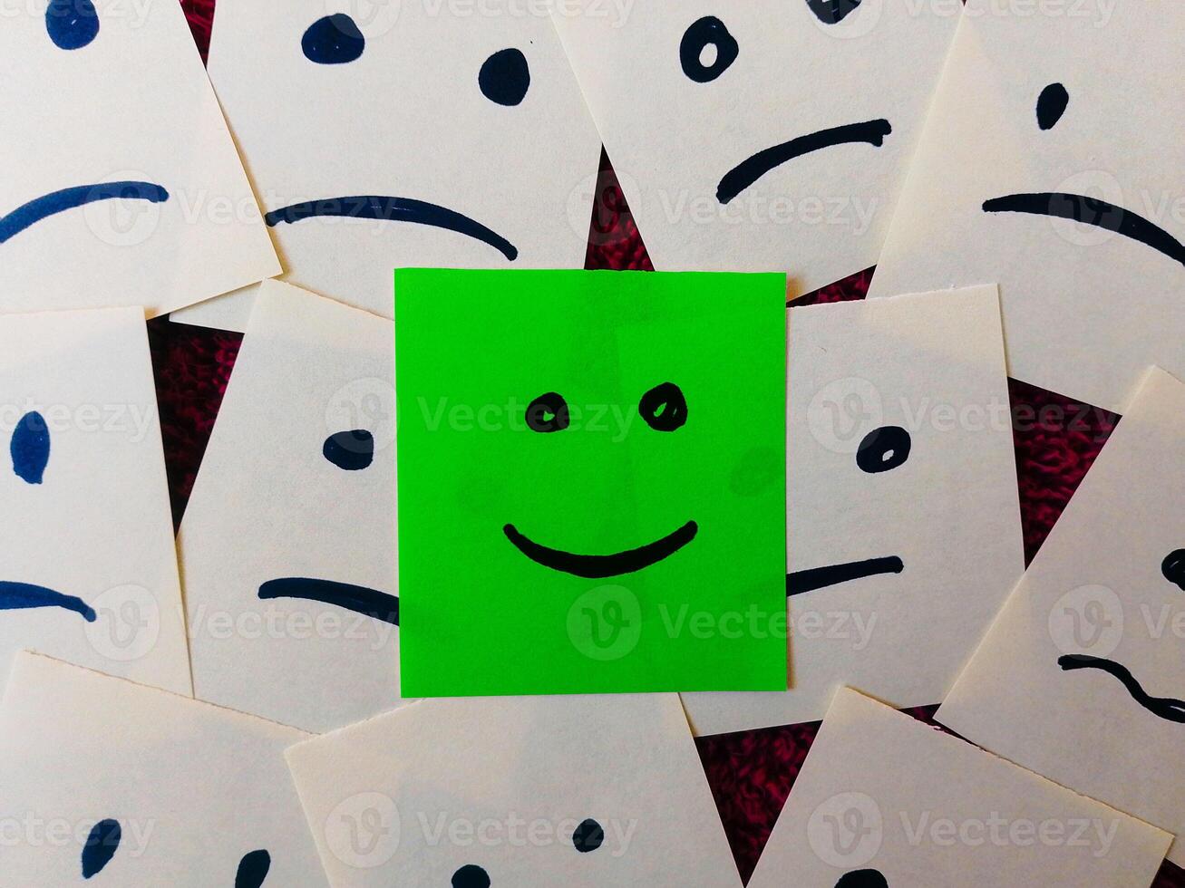 sticky notes with All sad and one Happy face - Unhappy and Happy Team Concept photo