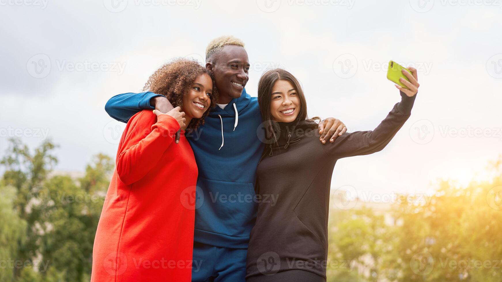 Multi ethnic friends outdoor. Diverse group people Afro american asian spending time together photo