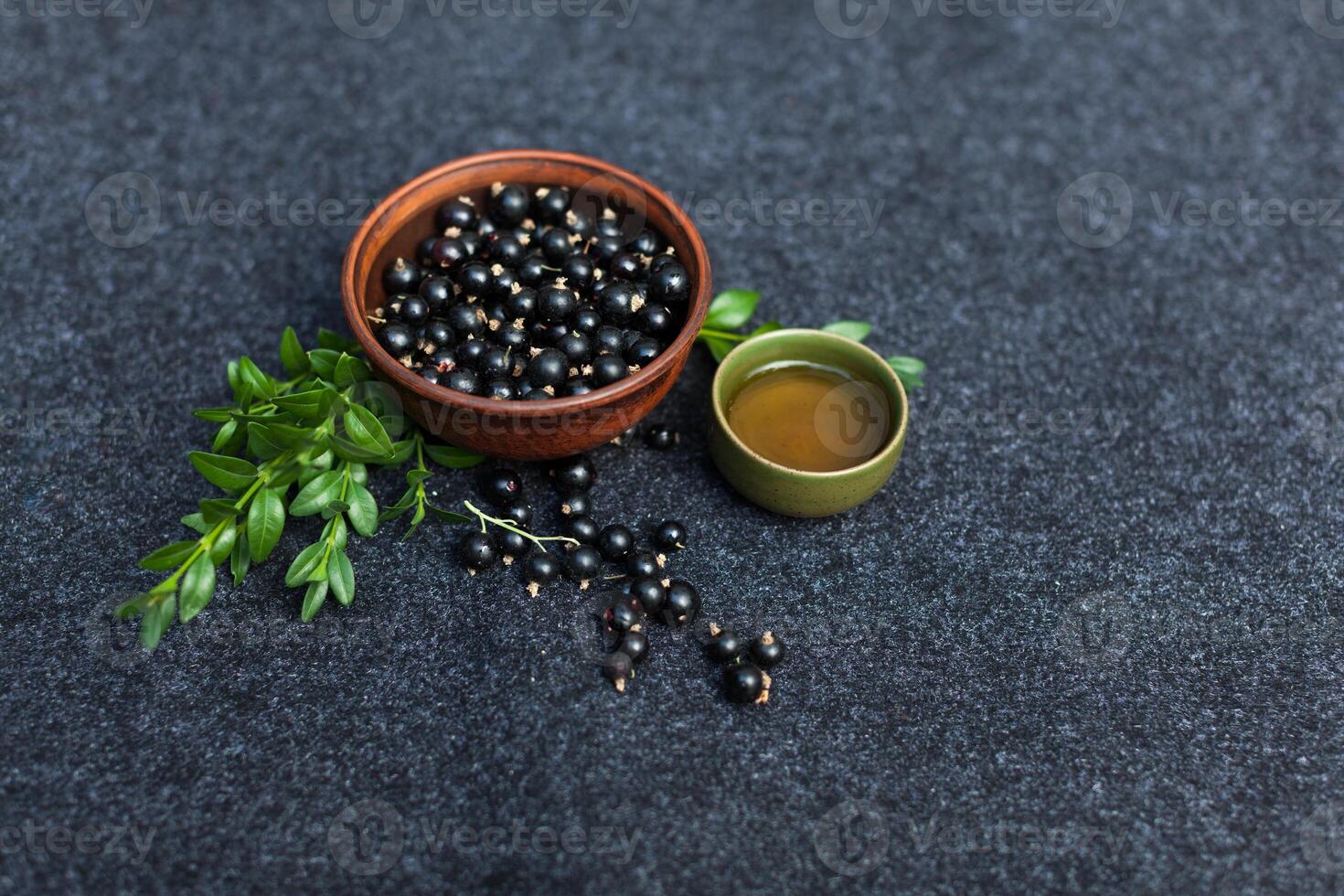 Traditional Chinese tea ceremony with black currant, fruit tea and healthy food. Photo without people. Summer natural vitamins and berries