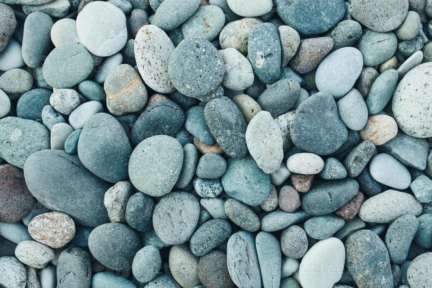 abstract background with dry round peeble stones. Sea stone close up photo