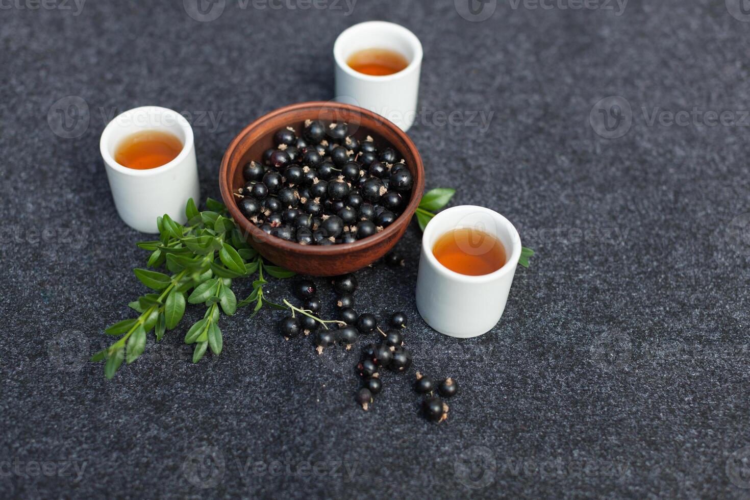 Traditional Chinese tea ceremony with black currant, fruit tea and healthy food. Photo without people. Summer natural vitamins and berries