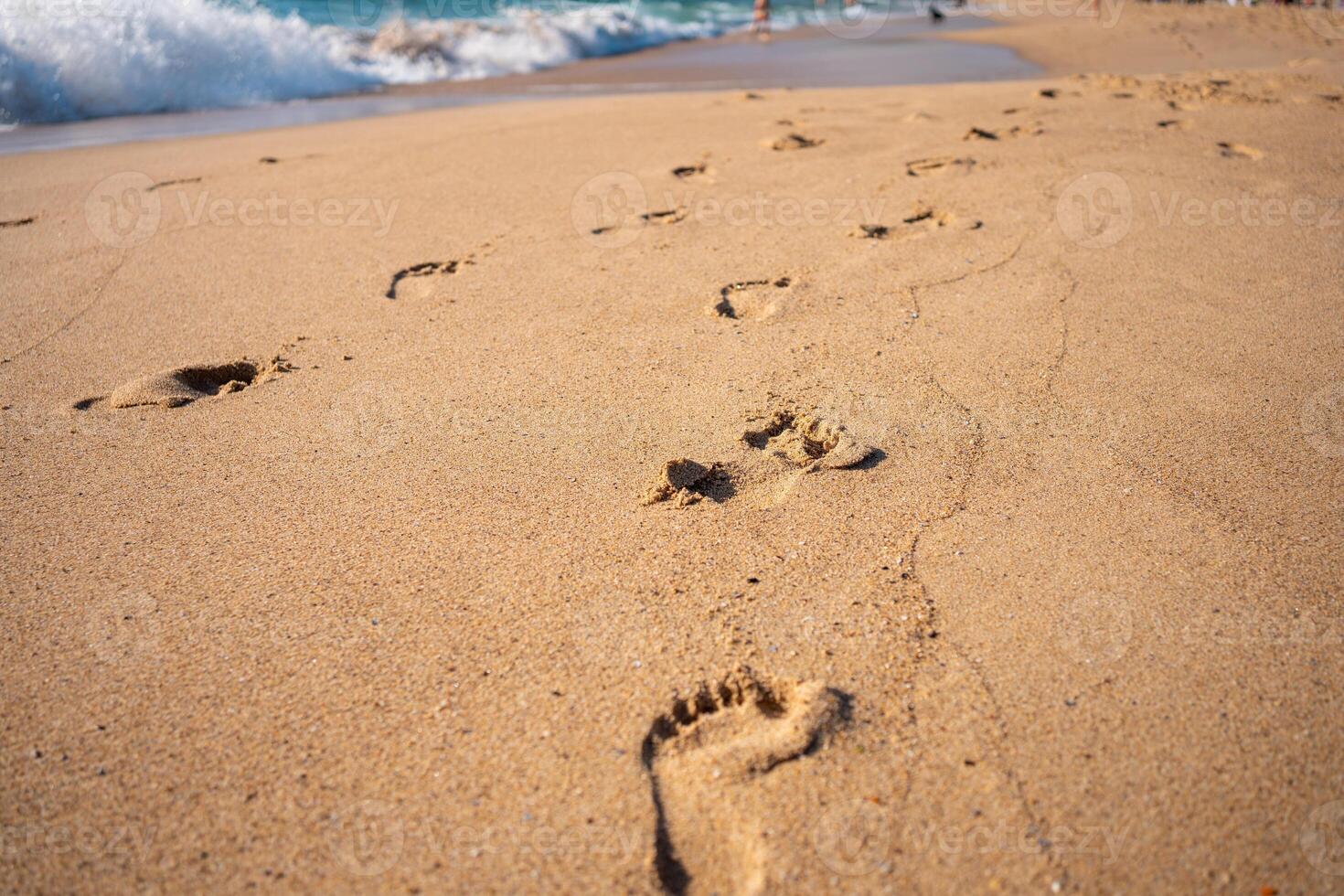 Footprints On Ocean Sandy Beach photo