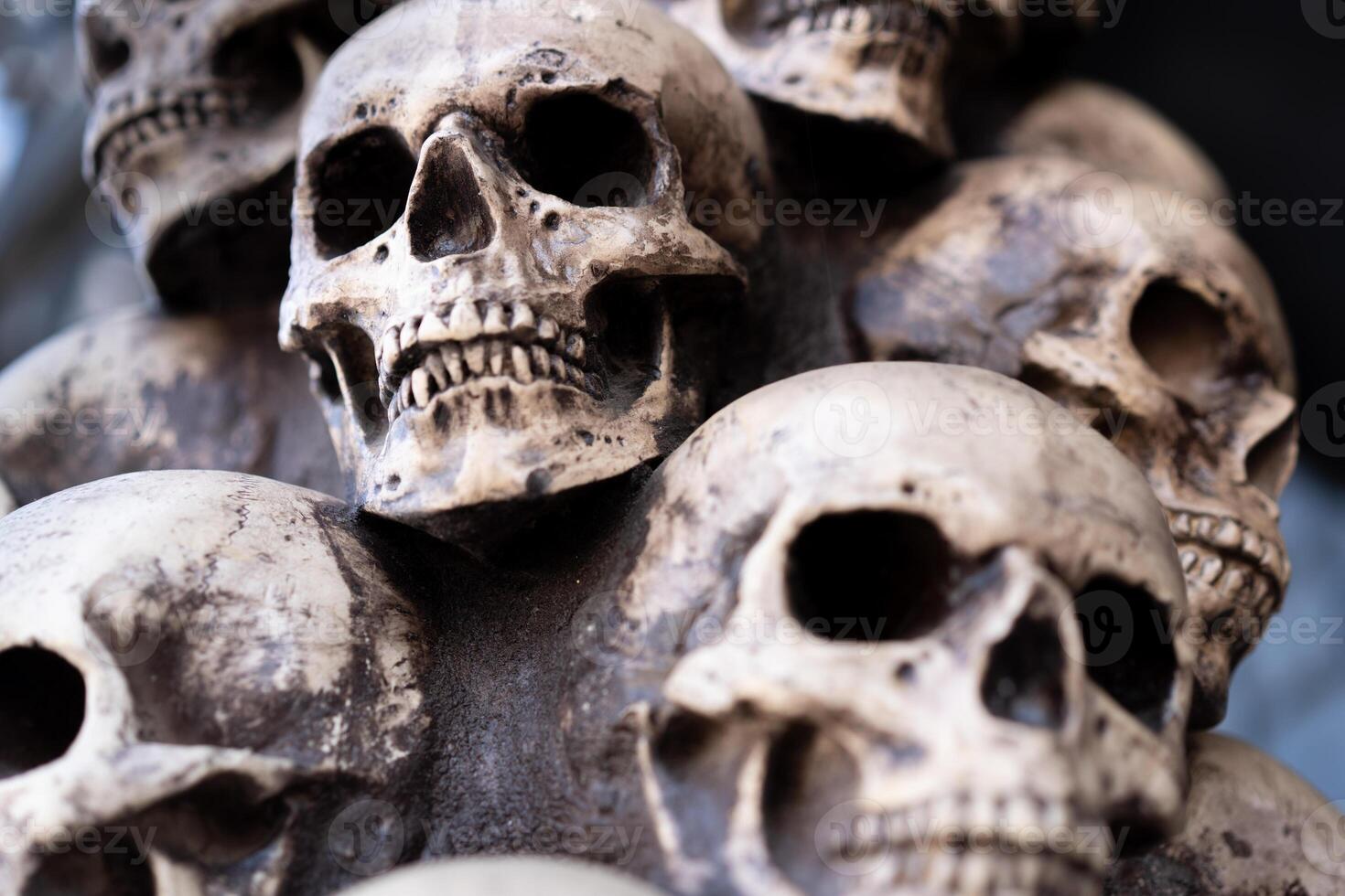 Skull Halloween Background Many People Skulls Stand on top of each other. Mystic creepy concept. Abstract nightmare occult memorial photo