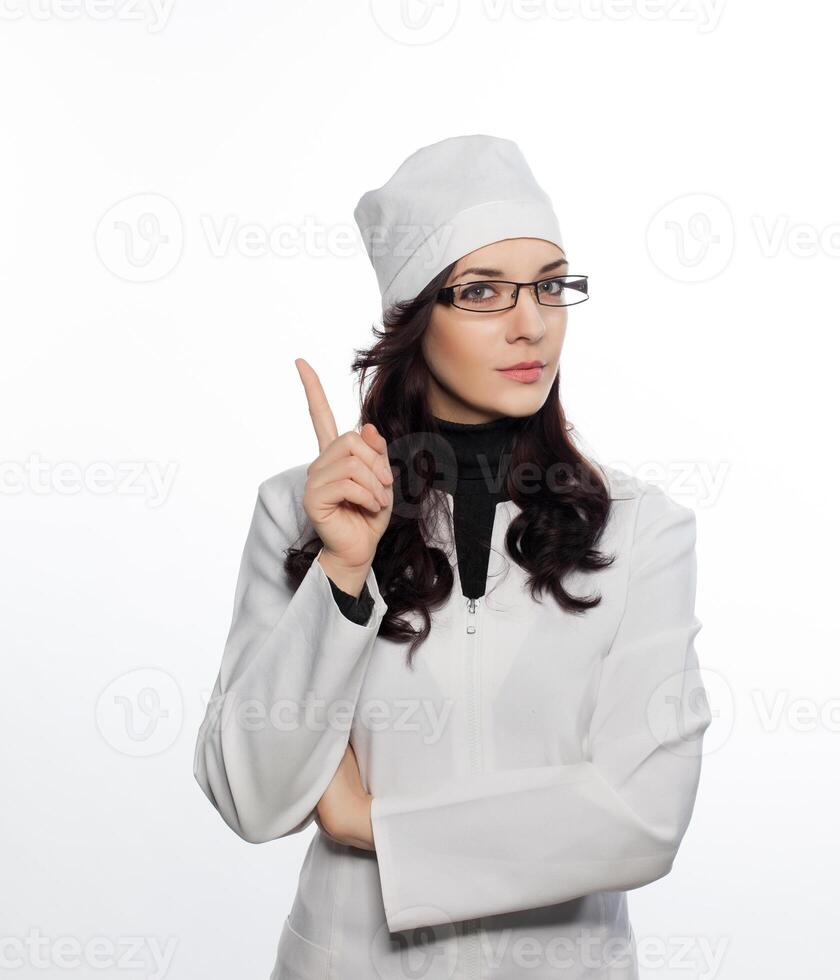 a woman in a white coat and glasses photo