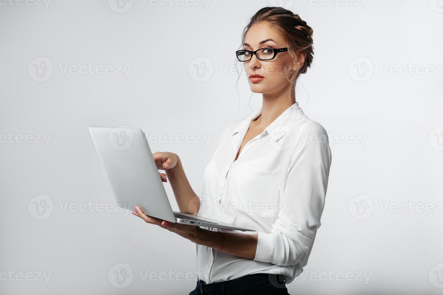 businesswoman portrait in studio with gray background photo