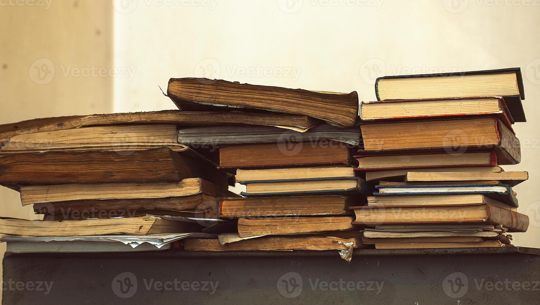 old books in stacks photo