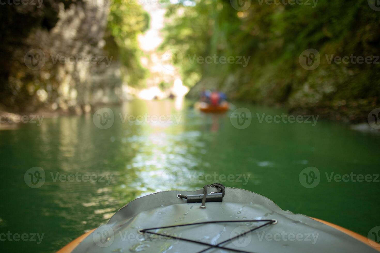 Kayaking on the river. group of people in a boat sailing along the river. Rowers with oars in a canoe. Rafting on a kayak. Leisure. photo