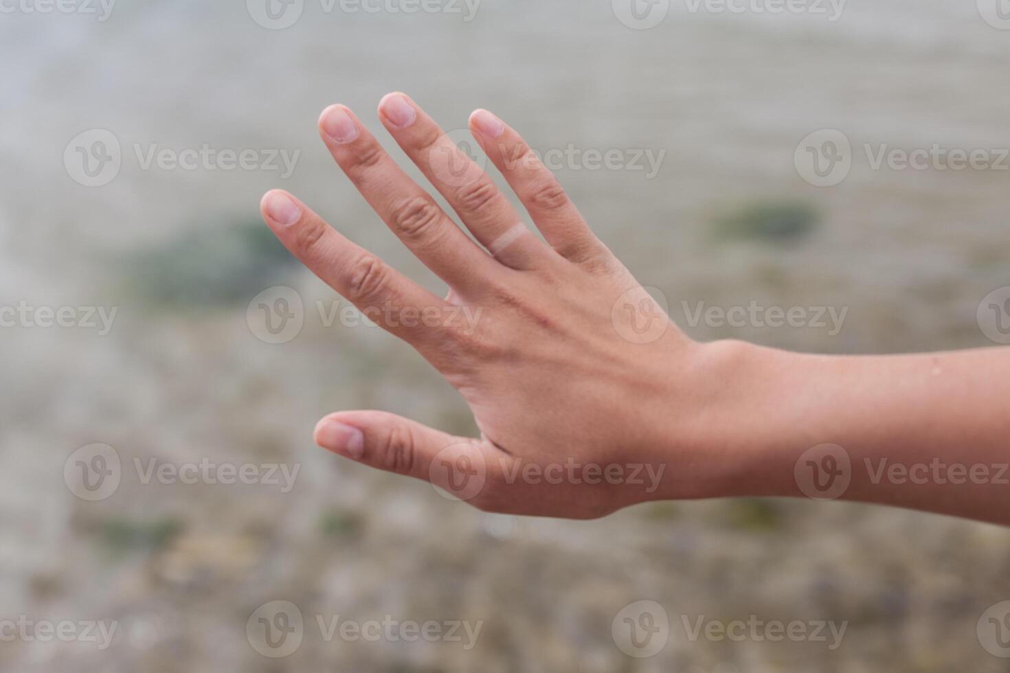 Hand without engagement ring with suntan. The girl took off the wedding ring on vacation that no one knew that she was married photo