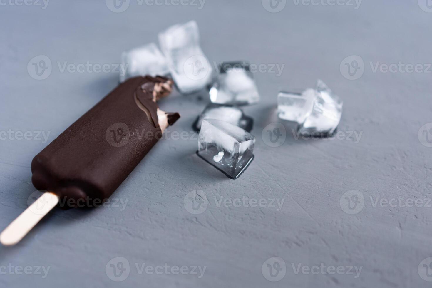 ice cream stick  on dark  background  covered chocolate sticks frozen Popsicle and Lolly sweet dessert  Flat lay photo