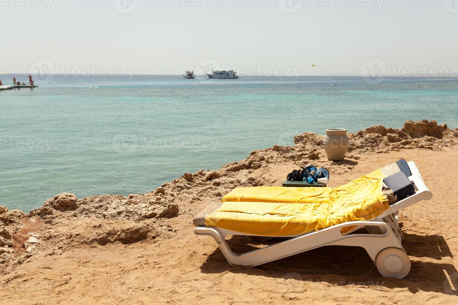 Half turn view chaise longues on the beach beach chaise longues photo