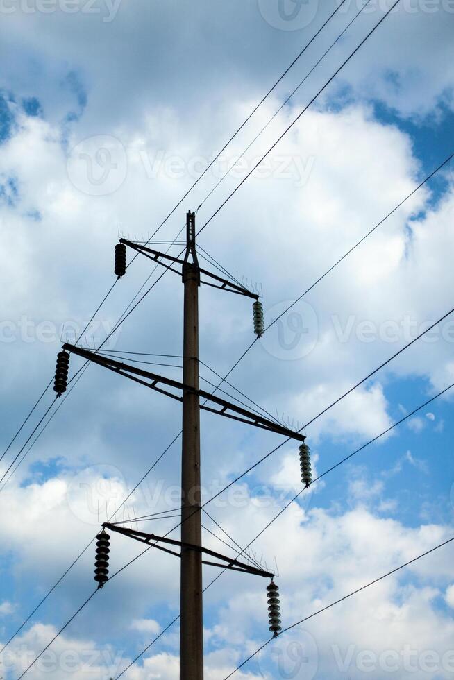 power line pole on the background of beautiful clouds photo