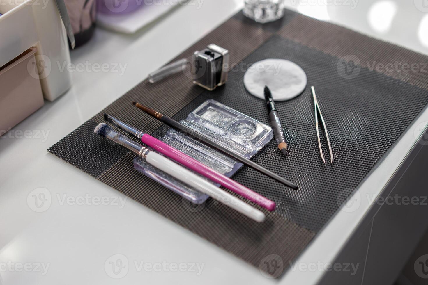 Makeup tools. Beautician workplace. Brushes for eyebrow dyeing. photo