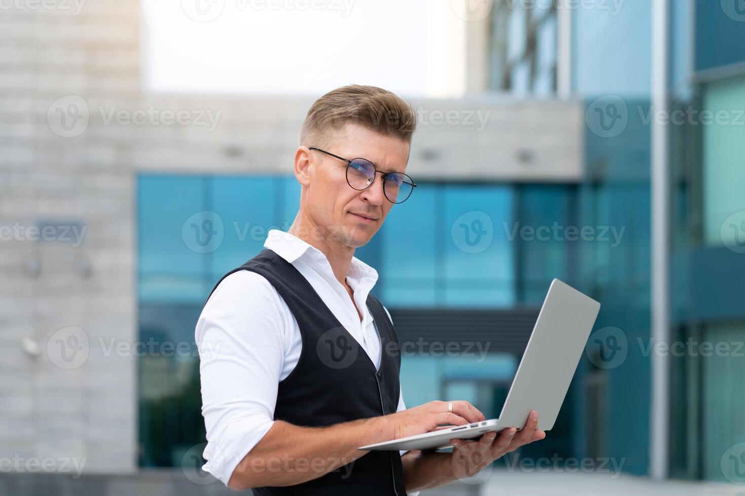 Business. Businessman Using Laptop Outdoor Summer Day photo