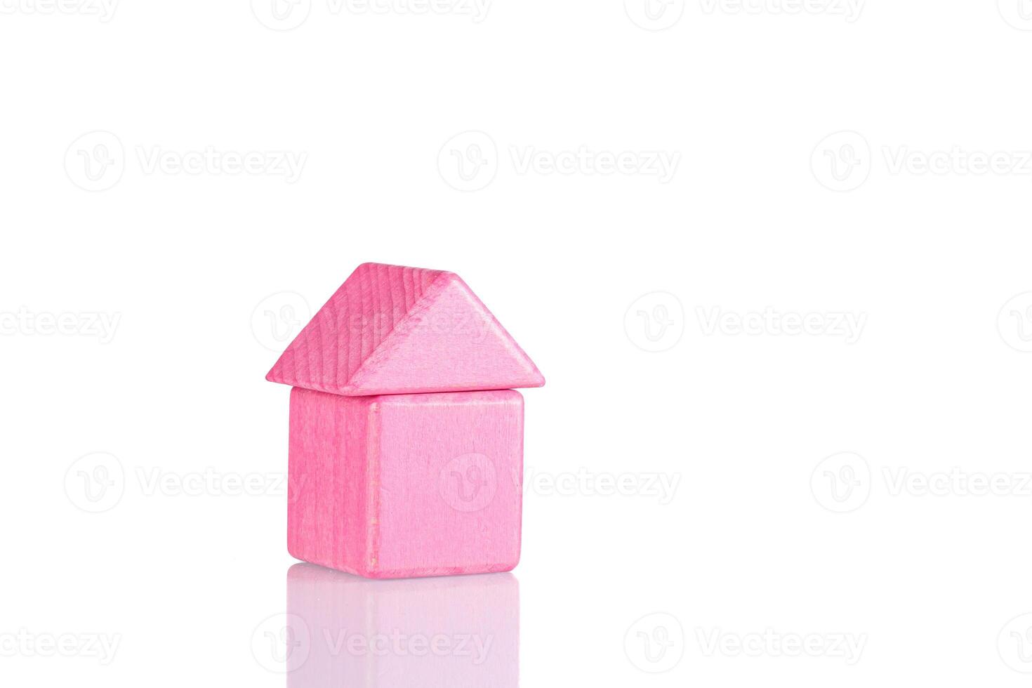 Wooden house of pink color on a white background photo