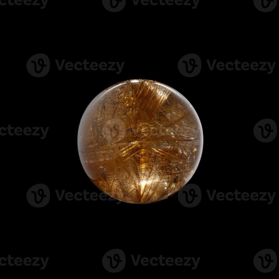 Ball of quartz with rutile on a black background photo