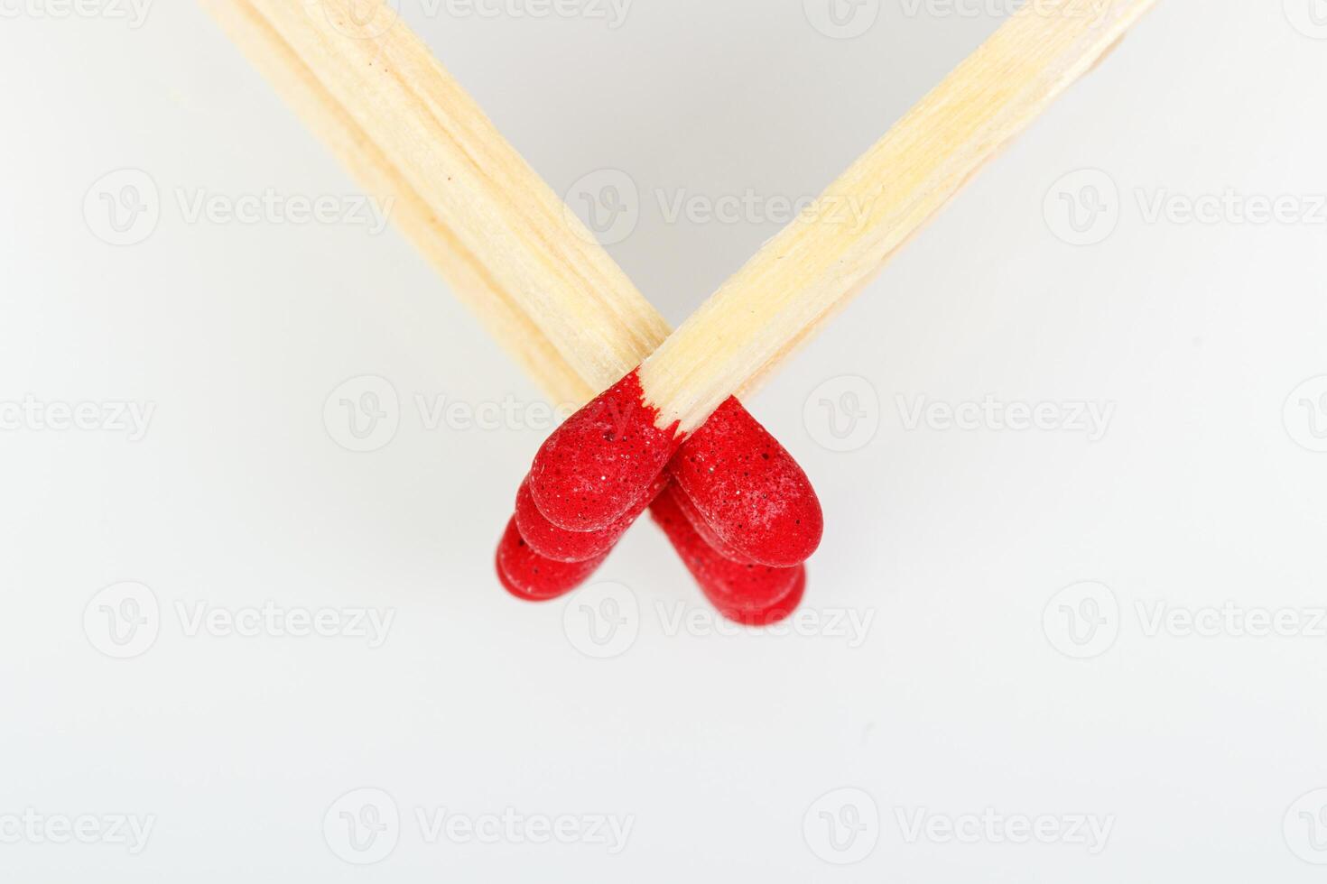 matches with a red head on a white background photo