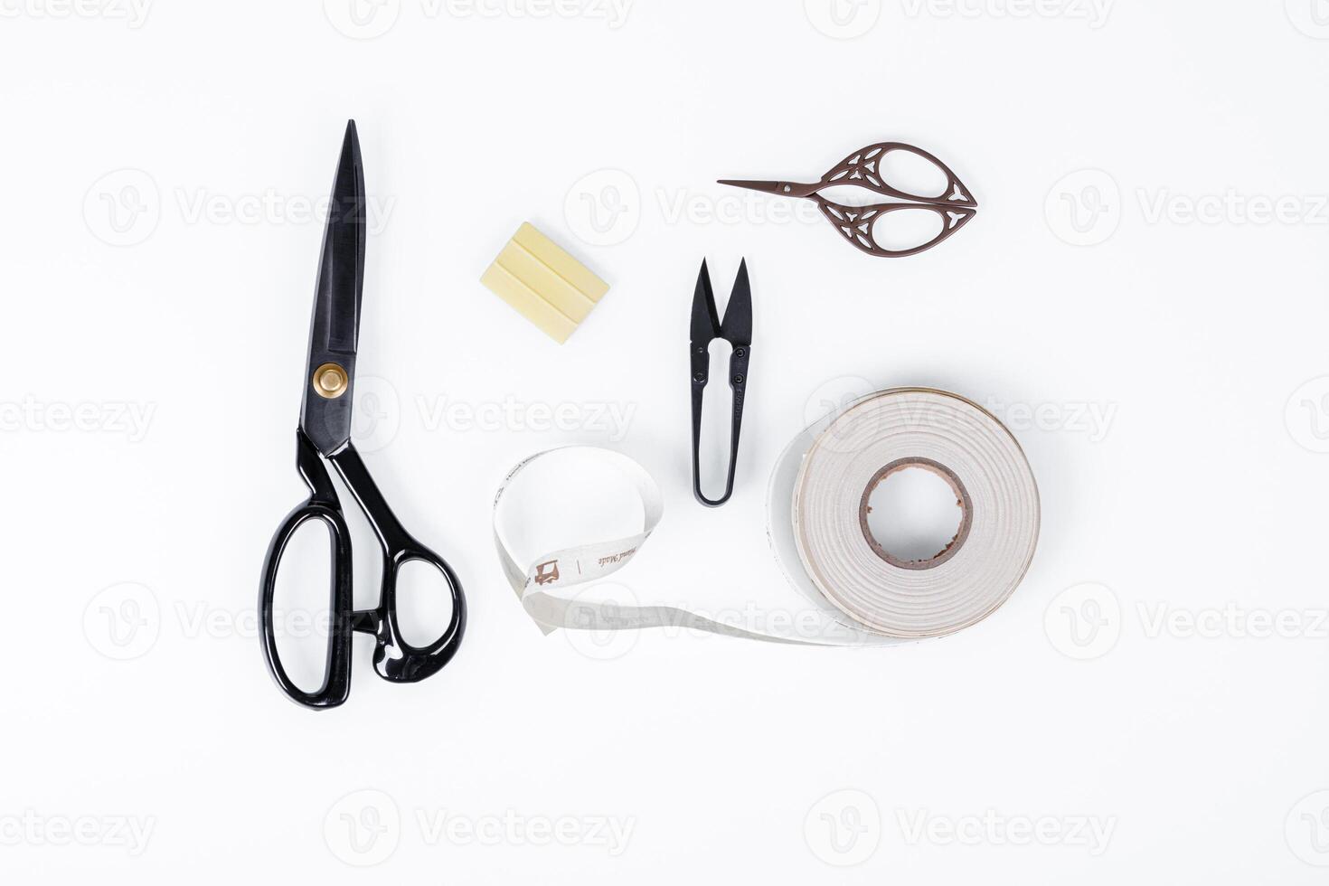 set of ruler, chalk, sticky tape, scissors for sewing on white background photo