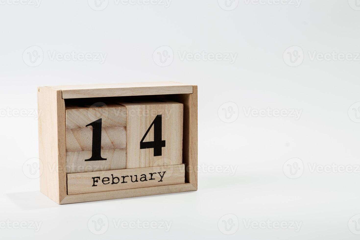 Wooden calendar February 14 on a white background photo