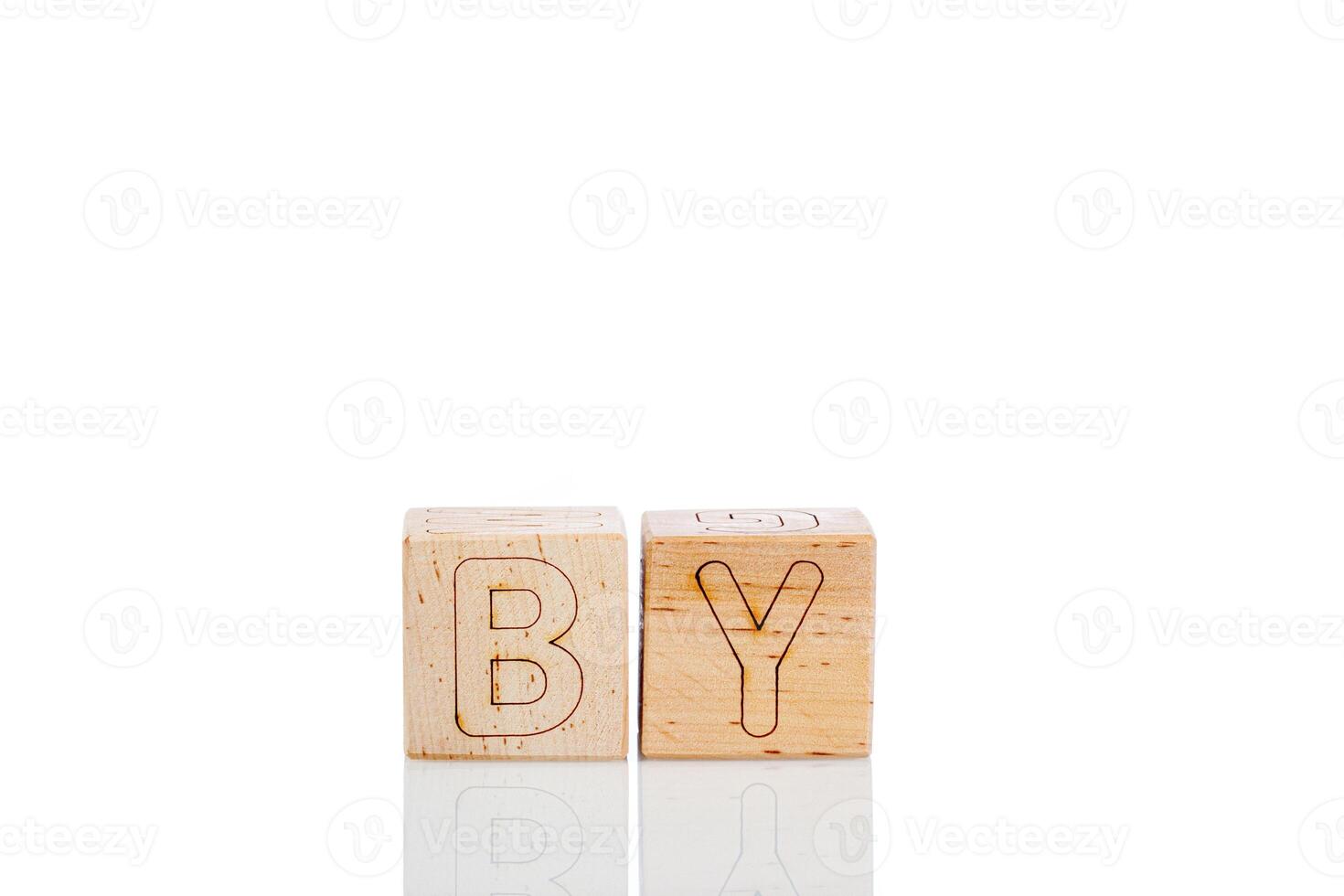 Wooden cubes with letters by on a white background photo