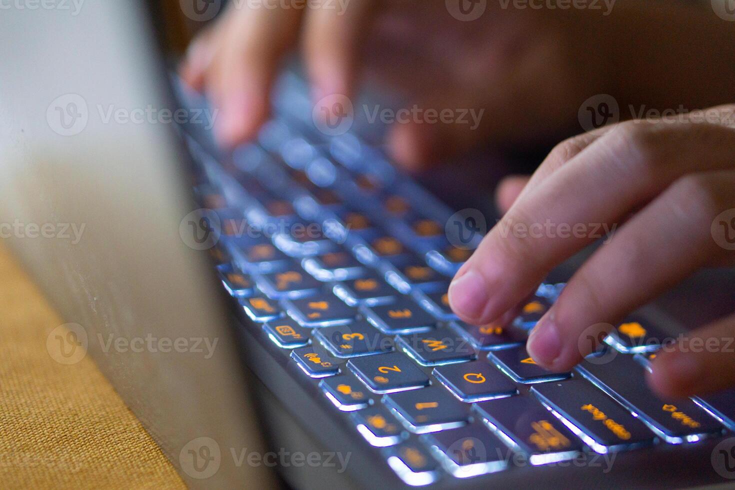 Close up image of hands typing on laptop computer keyboard and surfing the internet at home. Freelancer copywriter working project, typing text, edit something. Remote job concept photo