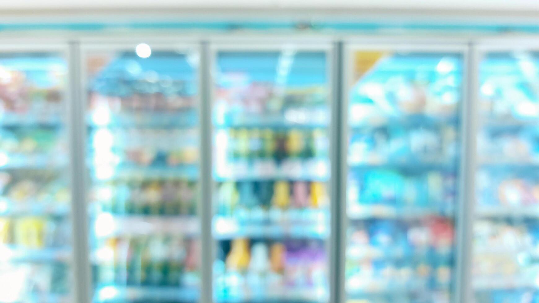 supermarket aisle and shelves blurred background. grocery store retail business concept photo