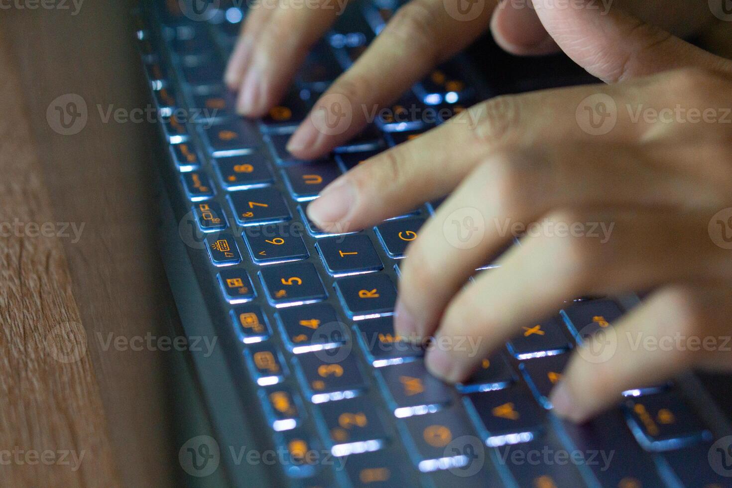 Close up image of hands typing on laptop computer keyboard and surfing the internet at home. Freelancer copywriter working project, typing text, edit something. Remote job concept photo