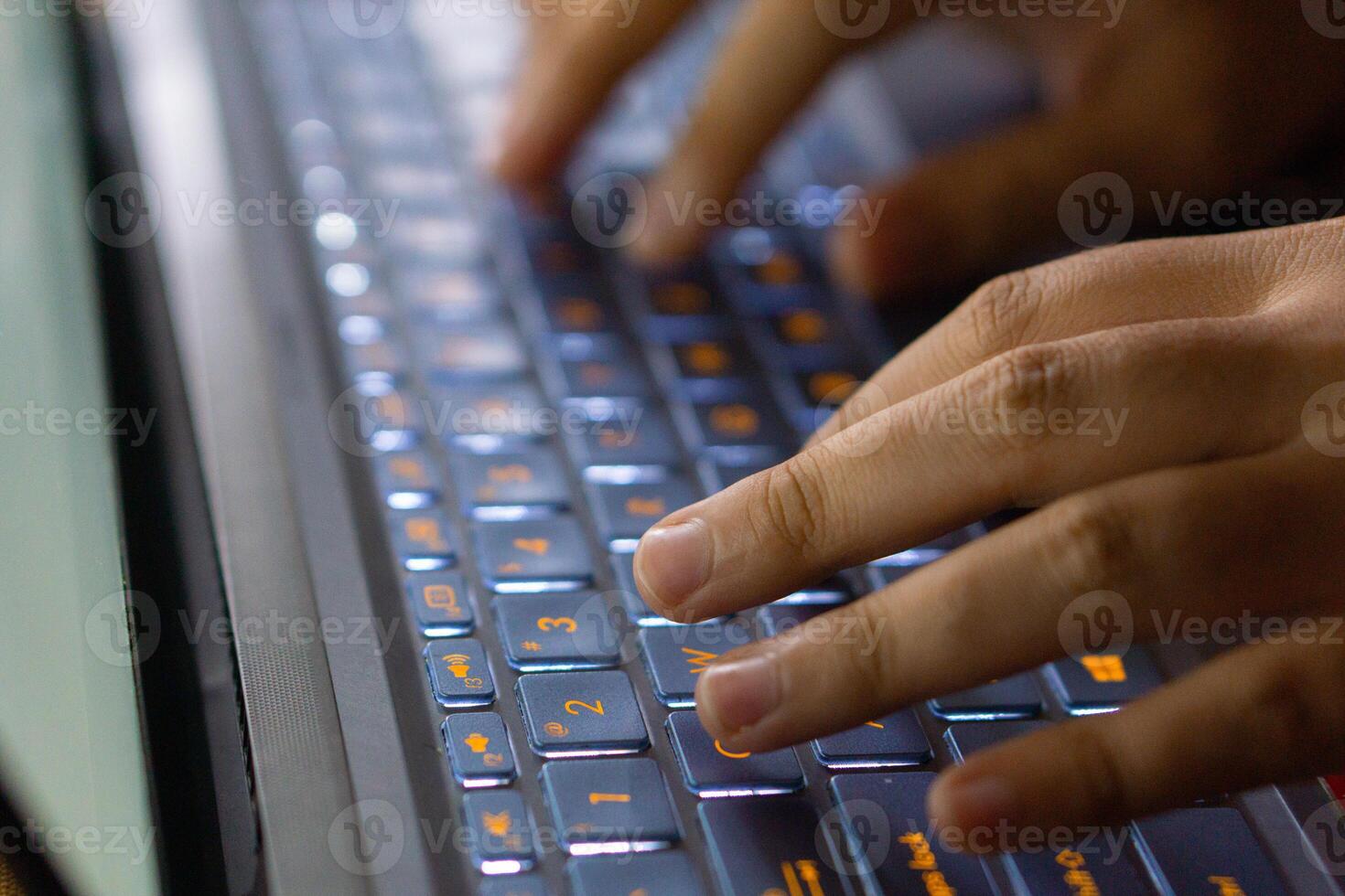 Close up image of hands typing on laptop computer keyboard and surfing the internet at home. Freelancer copywriter working project, typing text, edit something. Remote job concept photo
