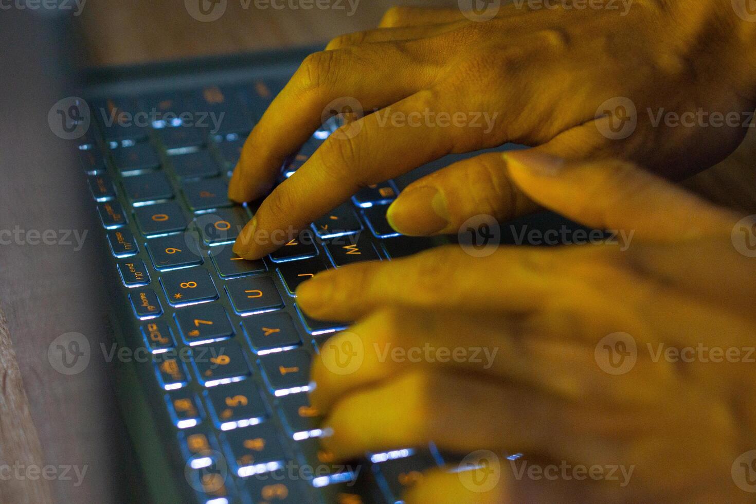 Close up image of hands typing on laptop computer keyboard and surfing the internet at home. Freelancer copywriter working project, typing text, edit something. Remote job concept photo