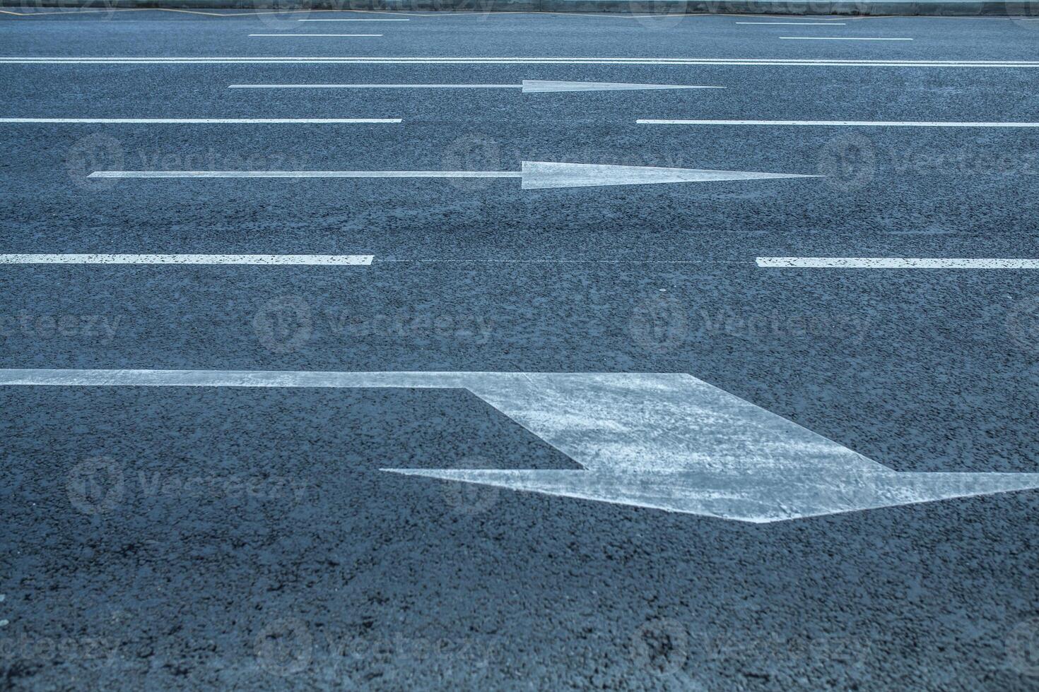 Road lanes with arrow markings photo