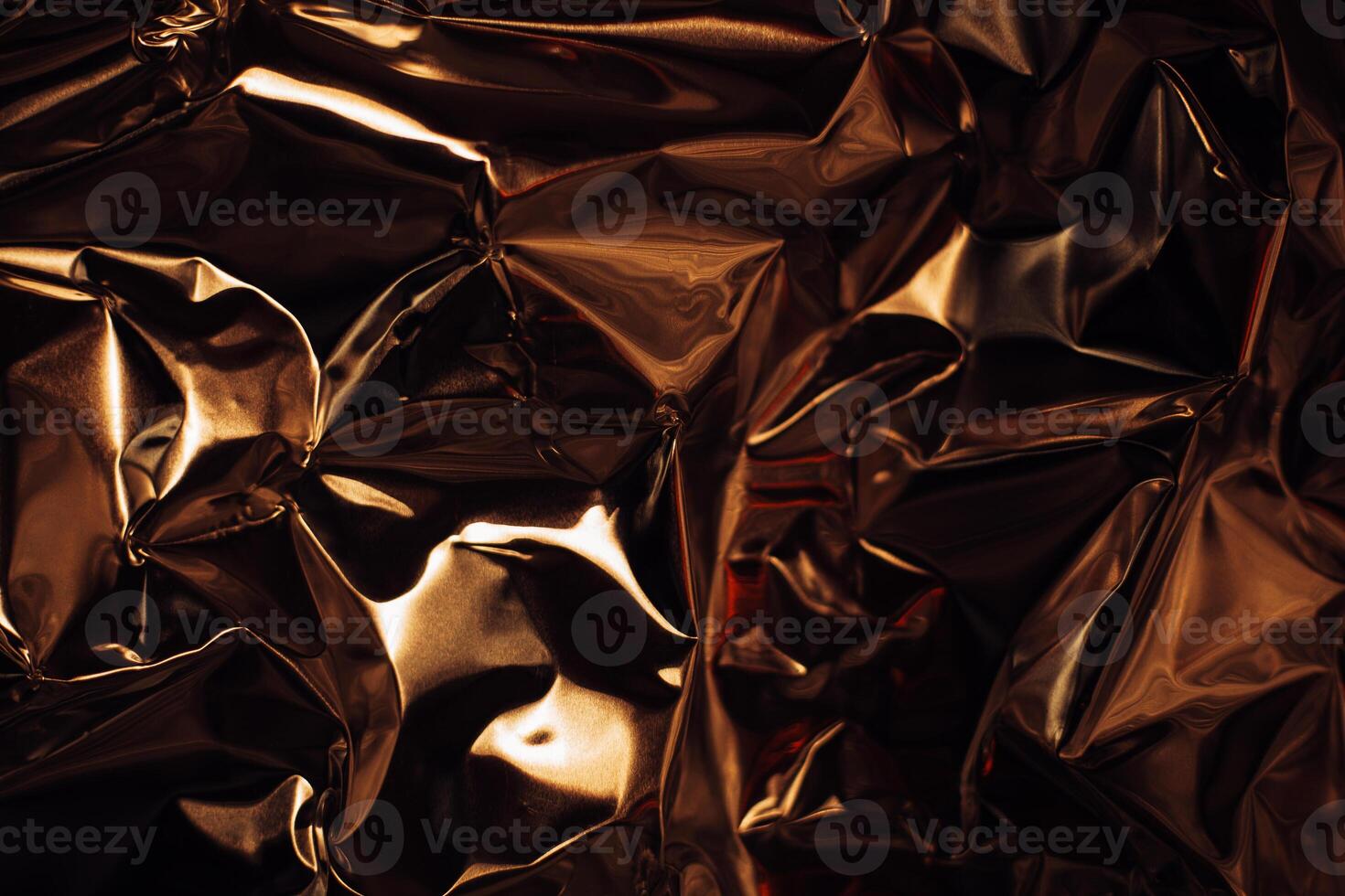 Full frame take of a sheeT of crumpled gold aluminum foil photo