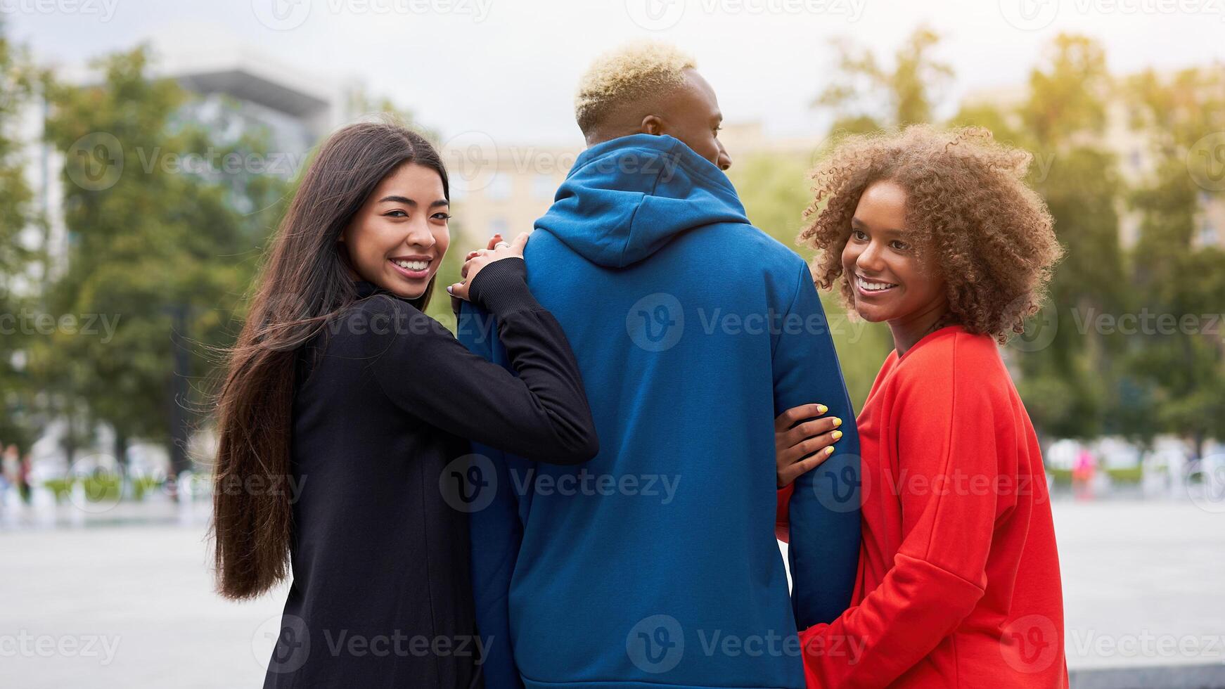 Multi ethnic friends outdoor. Diverse group people Afro american asian spending time together photo