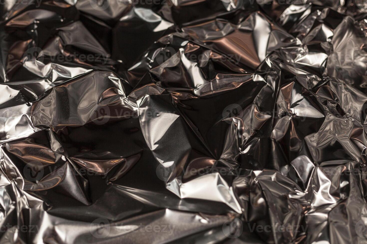 Full frame take of a sheeT of crumpled silver aluminum foil photo