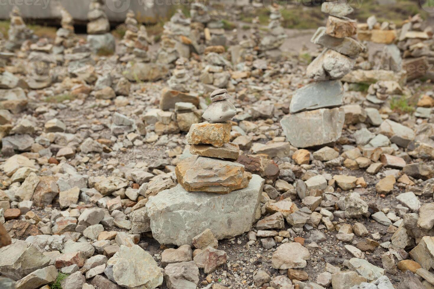 Stones stacked one on the other. Instalation near the Memorial naval aviation Cape of the Goat, France photo