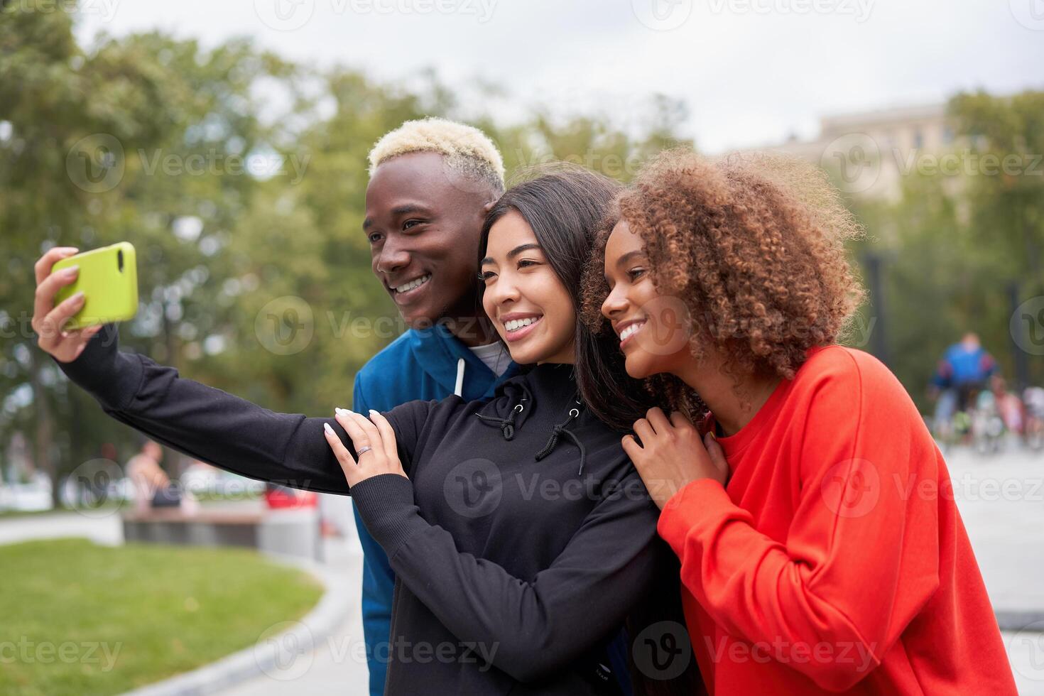 Multi ethnic friends outdoor. Diverse group people Afro american asian spending time together photo